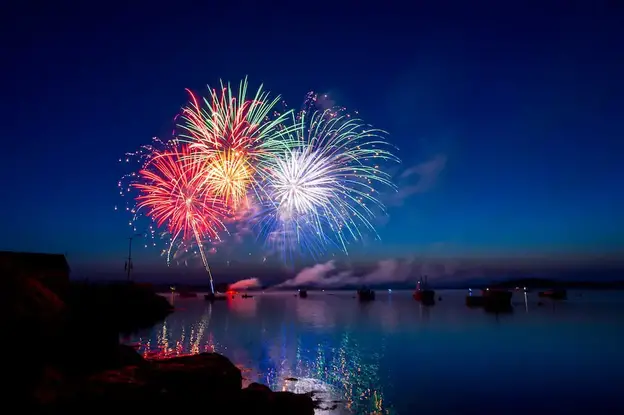 green, red, and white fireworks on sky at nighttime